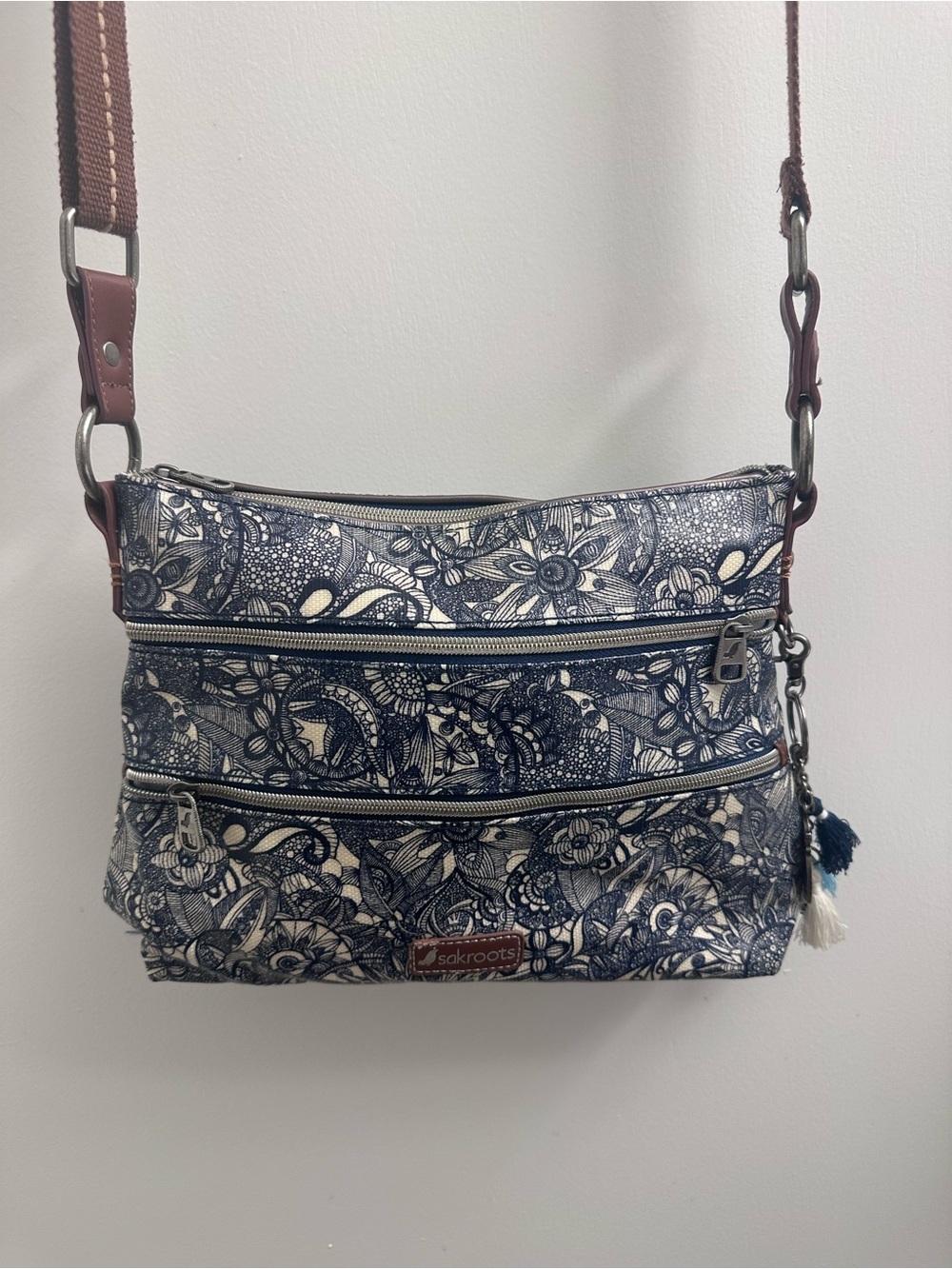 Sakroots Navy and Cream Floral Crossbody Bag with Tassel